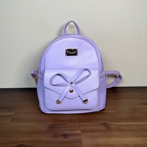 Purple mini backpack with bow